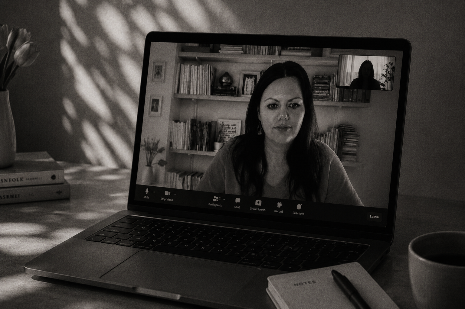 Caitlin on a laptop screen during an online conversation